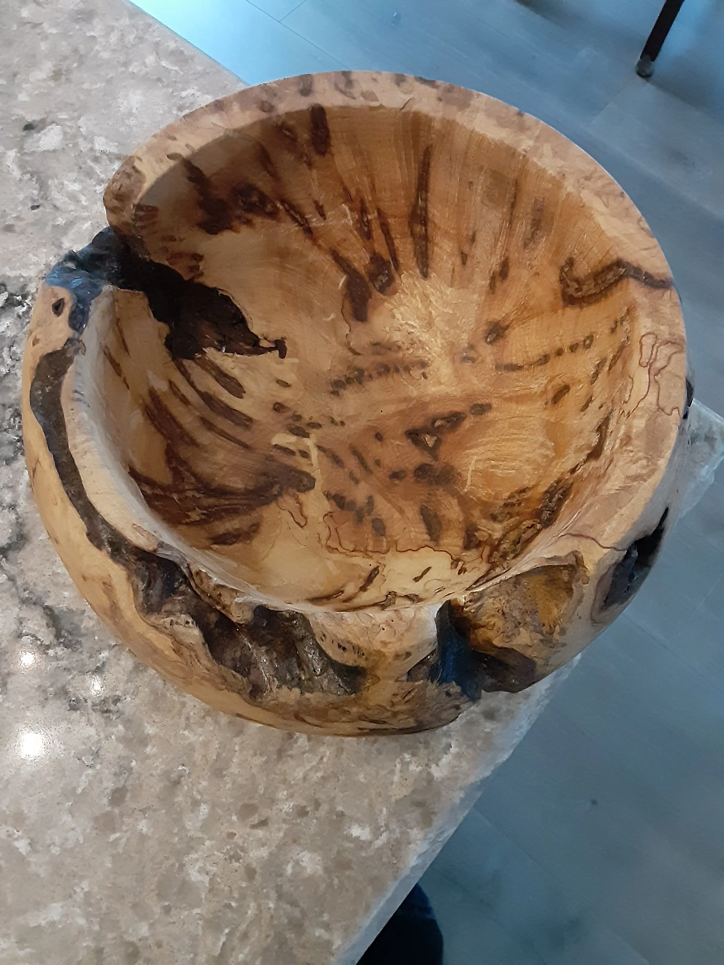 A finished turned burl bowl